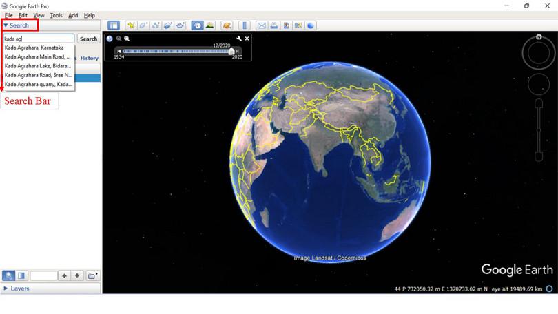 Searching for a specific location.
: A screenshot showing the use of the search bar on the Google Earth application.
