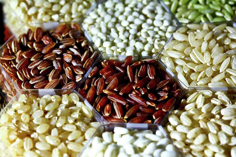 An image of different varieties of rice of different colours.
